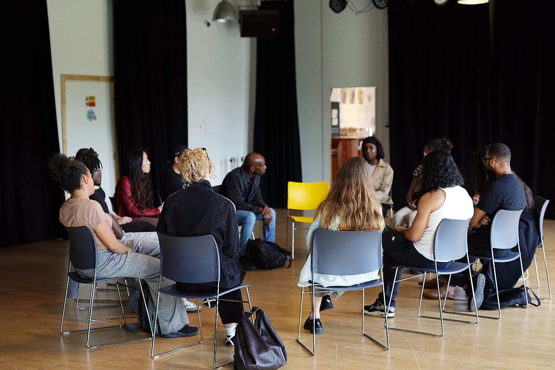 Participants sitting in a circle talking at an ARSGO workshop